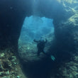 Load image into Gallery viewer, A diver at Bens arch, Cirkewwa, a great place for an open water diver course in Malta
