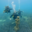 Load image into Gallery viewer, Divers around the Statue on our house reef in Saint Paul's Bay, Malta
