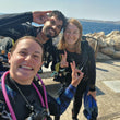 Load image into Gallery viewer, Happy divers on a surface interval at Cirkewwa during their PADI Open Water Diver referral course in Malta
