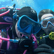 Load image into Gallery viewer, Two divers underwater taking a selfie on the PADI Advanced open water course

