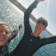 Load image into Gallery viewer, Two divers celebrating after a successful PADI rescue diver course on Manoel Island, Malta
