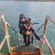 Load image into Gallery viewer, A diver exiting the water with another unresponsive diver during the PADI rescue diver course on Manoel Island, Malta
