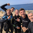 Load image into Gallery viewer, A group of divers at Wied Iz-Zurrieq posing before a pleasure dive to the famous wreck of the Um El Faroud
