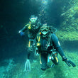 Load image into Gallery viewer, Smiling Open Water divers at Qawra Point dive site
