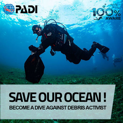 A diver with a mesh bag full of trash on the PADI Dive Against Debris specialty course in Saint Paul's Bay, Malta. 