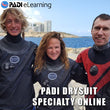 Load image into Gallery viewer, 3 divers wearing drysuits between dives at the HMS Maori
