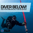 Load image into Gallery viewer, A diver in blue Maltese waters holding a pink DSMB and reel ready to launch
