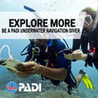 Load image into Gallery viewer, Two divers with slates and compasses on their PADI underwater navigator course in Malta
