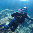 Load image into Gallery viewer, A diver giving the ok signal on a shallow reef dive in Malta
